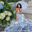 Robe en organza fleurie à épaules dénudées avec jupe longue et laçage.