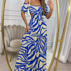 Robe longue à col une ligne imprimé et manches courtes avec taille creuse, pour les vacances d'été. Vêtements pour femmes.