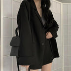 Blazer ample noir à revers et jupe assortie