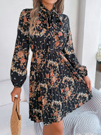 Robe longue plissée élégante à manches longues et taille nouée à imprimé floral pour femme