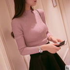 Pull mi-col roulé en fil retors pour femme