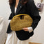Sac pochette coquillage tendance pour femmes