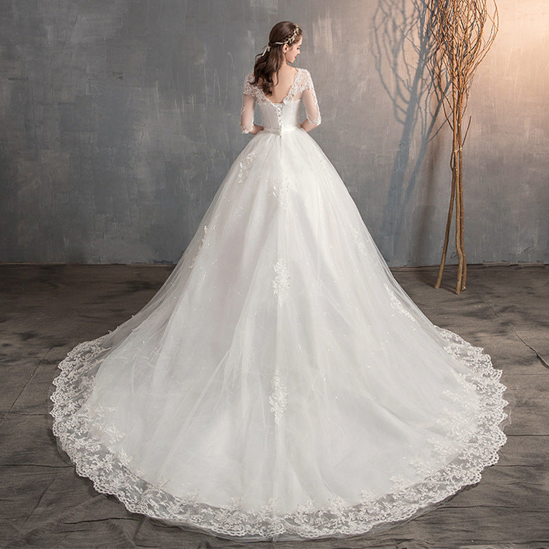 Robe de mariée traînante col V profond dentelle taille haute manches longues