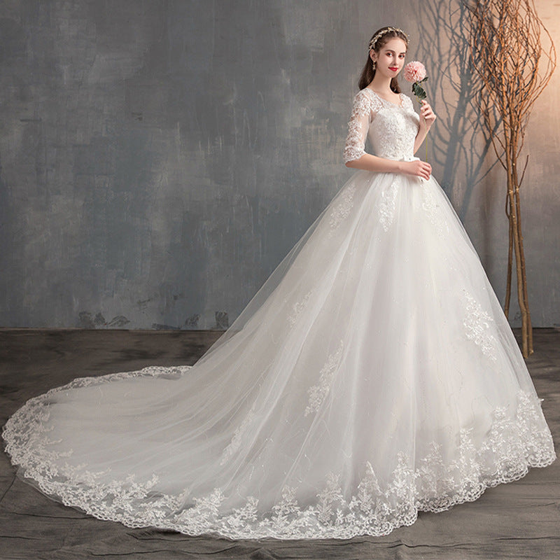 Robe de mariée traînante col V profond dentelle taille haute manches longues