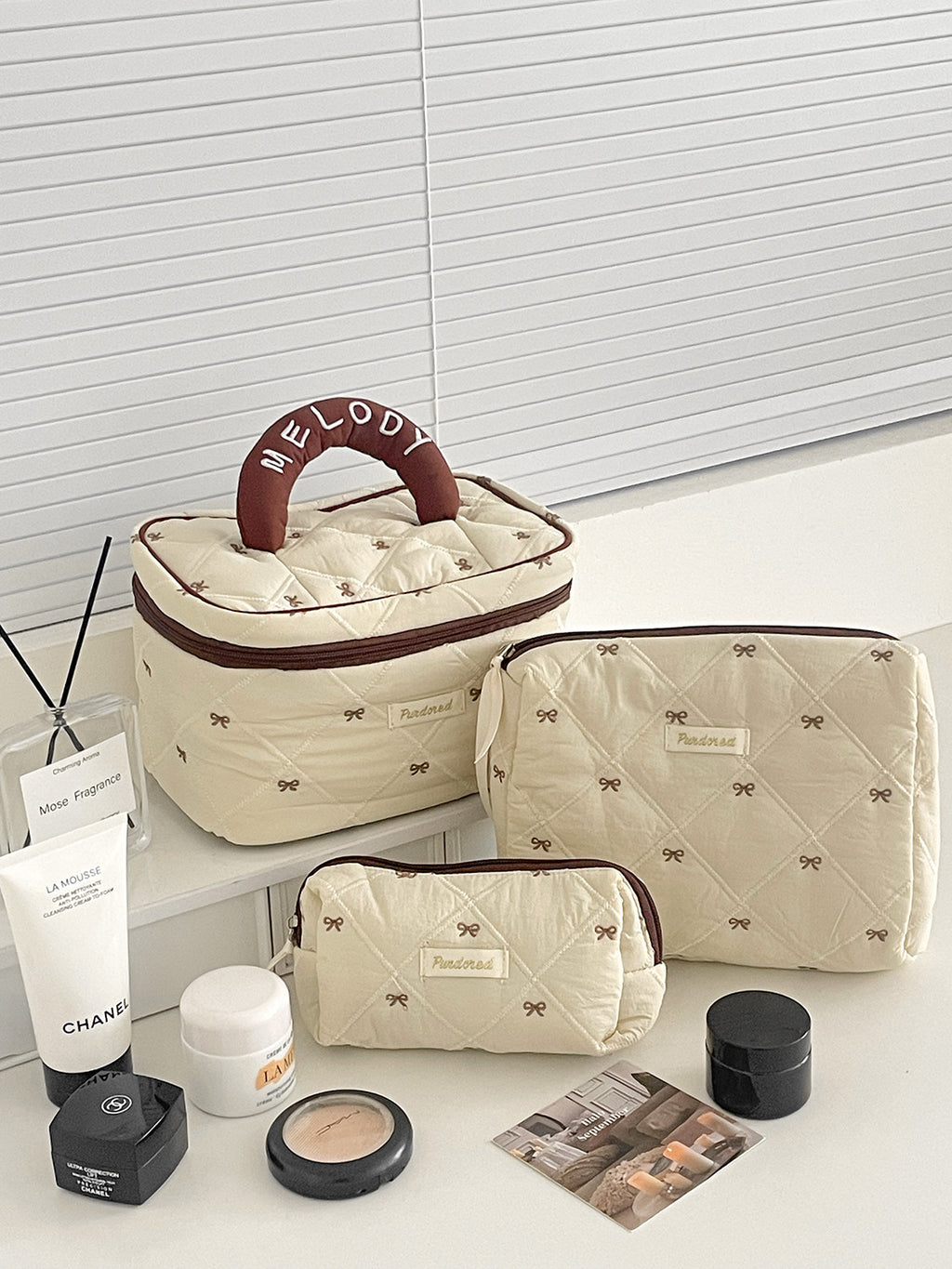 Trousse de maquillage grande capacité à nœud papillon