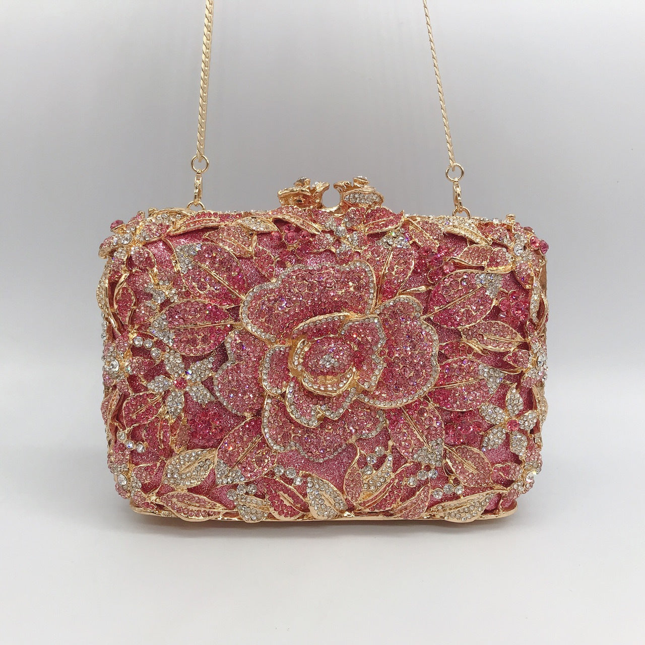 Pochette de soirée en métal rose, chaîne et diamants