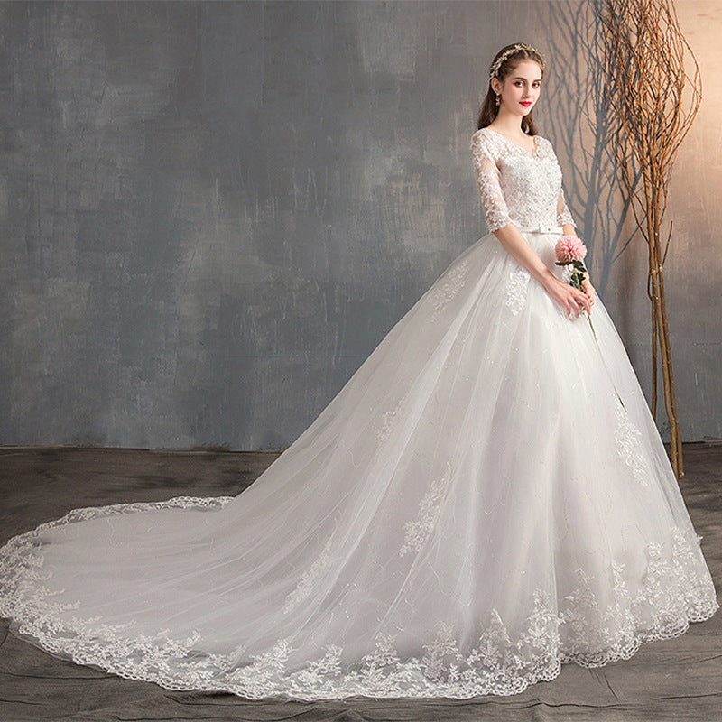 Robe de mariée traînante col V profond dentelle taille haute manches longues