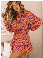 Robe à col montant imprimée à manches longues et taille élastique avec poches, pour l'export.