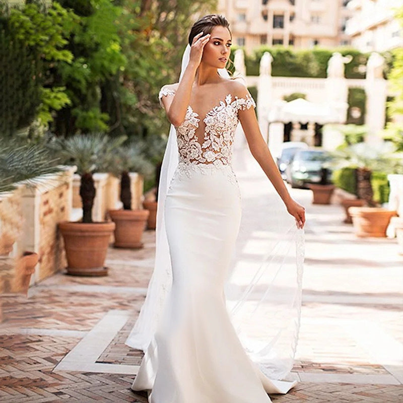 Robe de mariée sirène creuse à col profond pour femme
