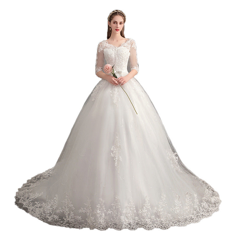 Robe de mariée traînante col V profond dentelle taille haute manches longues