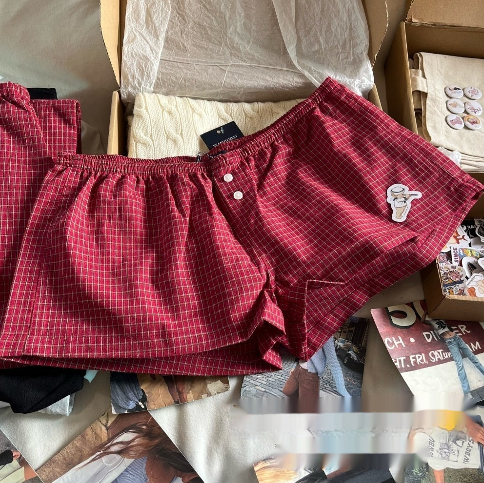 Shorts à carreaux rouges avec taille élastique et décoration de fermeture pour femmes