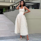 Robe sans manches à pompons pour femme