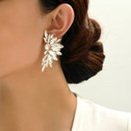 Boucles d'oreilles clous de luxe en cristal en forme d'ailes, strass scintillants, bijoux élégants pour femmes, soirée, mariage, bal de promo