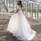 Robe de mariée grande taille amincissante pour les épaules