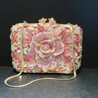 Pochette de soirée en métal rose, chaîne et diamants