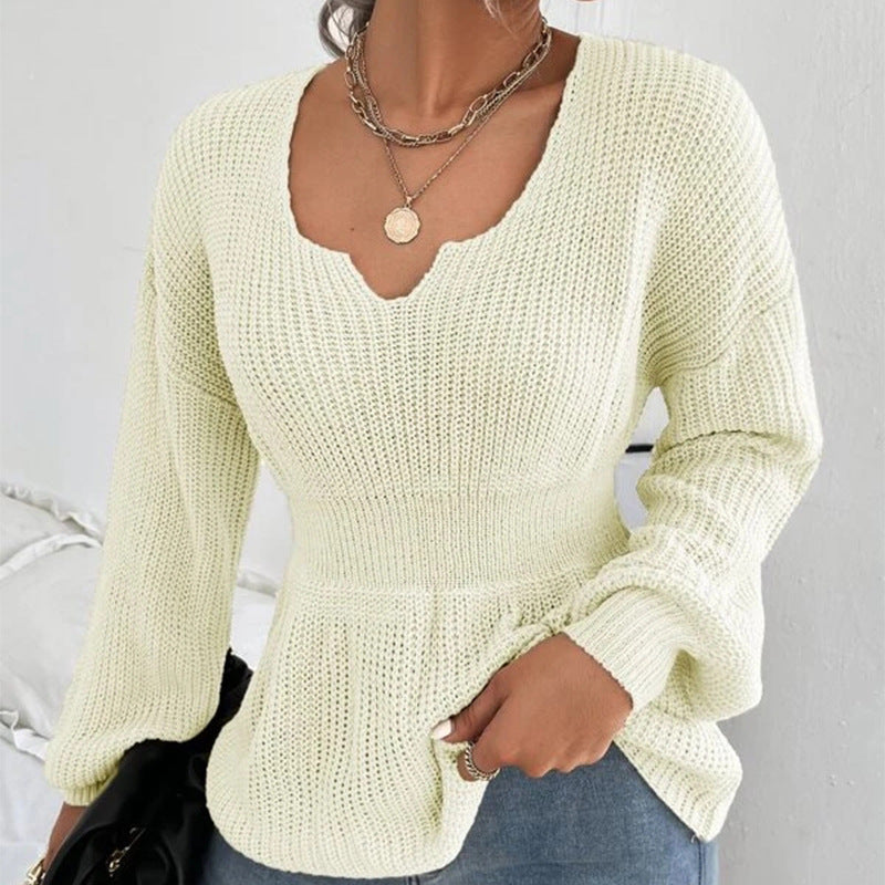 Pull femme à volants et taille ajustée