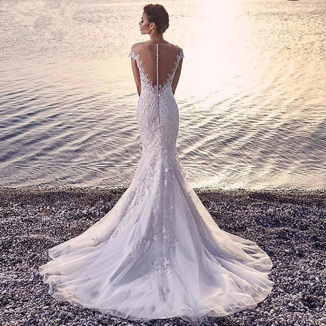 Robe de mariée sirène de princesse, blanche, traînante, transparente, dos nu, en dentelle Main Image