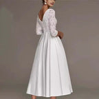 Robe de mariée mi-longue à manches longues, en dentelle, décolleté plongeant en V, coupe ajustée