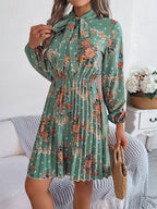 Robe longue plissée élégante à manches longues et taille nouée à imprimé floral pour femme