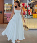 Robe mi-longue coupe ajustée à bretelles couleur unie