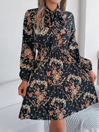 Robe longue plissée élégante à manches longues et taille nouée à imprimé floral pour femme