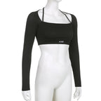 Ensemble deux pièces moulant tricoté de couleur unie avec lettres, haut court à manches longues et col rond, et leggings skinny taille haute