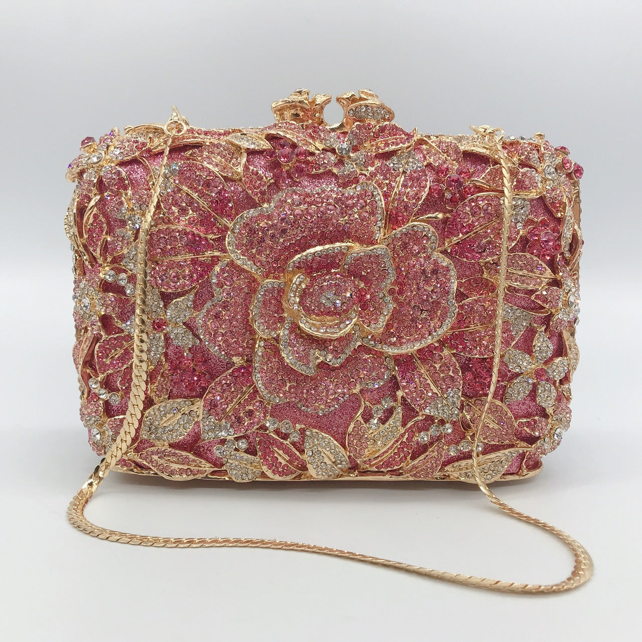 Pochette de soirée en métal rose, chaîne et diamants