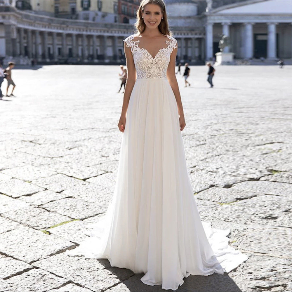 Une robe de mariée en mousseline série A, col en V, manches longues