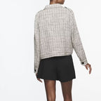 Blazer texturé en tweed pour femme avec poches plaquées