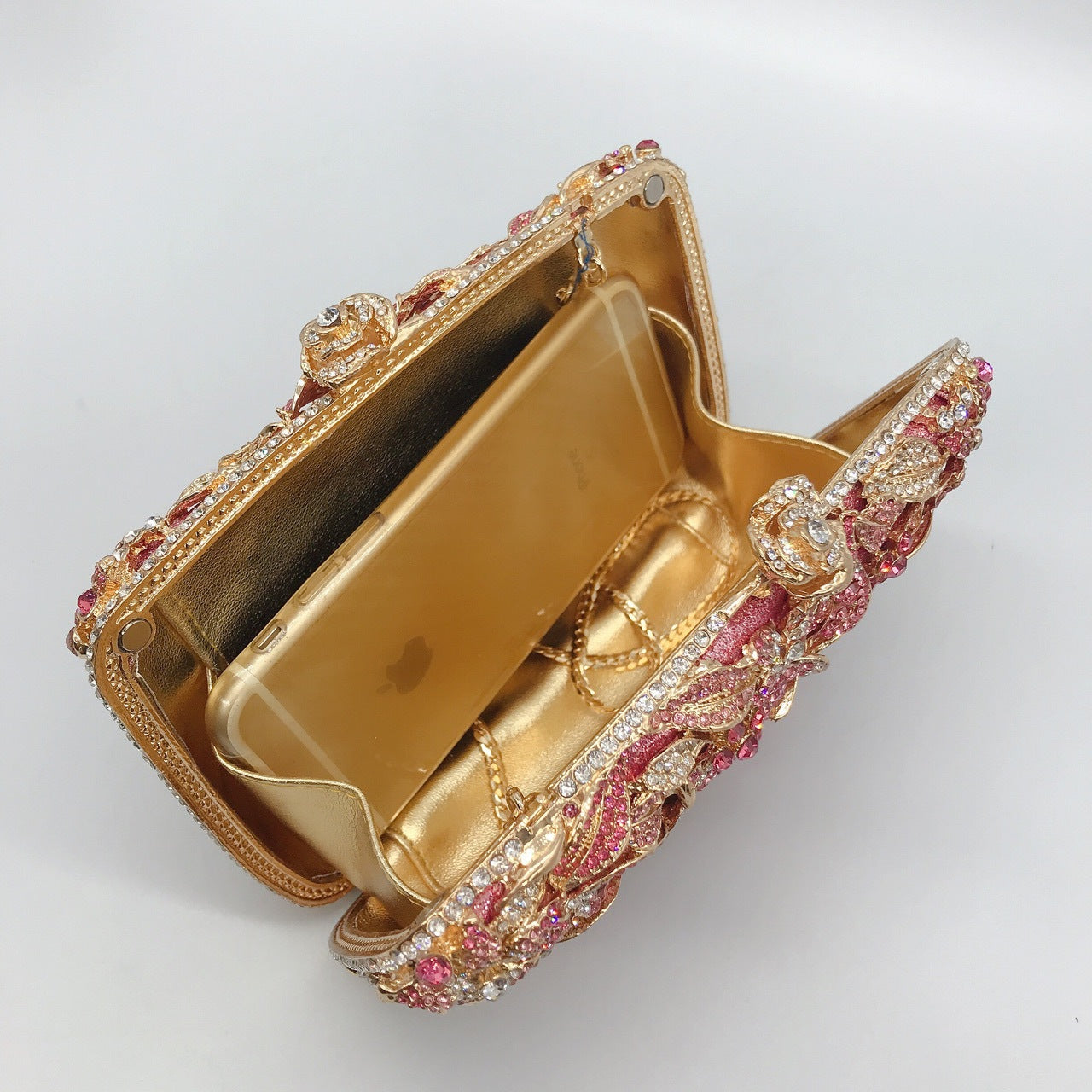 Pochette de soirée en métal rose, chaîne et diamants